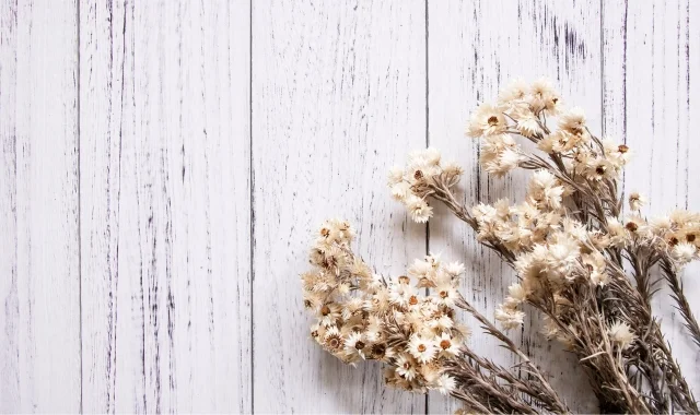 image of white wood table with dried flowers on it mobile version